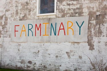 Multi coloured sign: FARMINARY