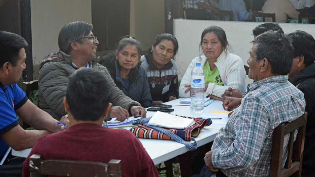 indigenous delegates from northern Argentina discuss round a table