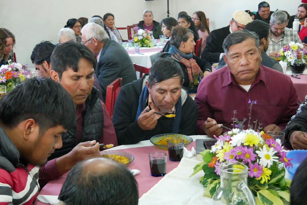 Local believers enjoy celebratory food together
