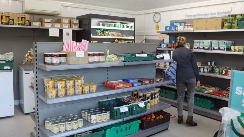 woman browses the shelves inside Cosham Larder