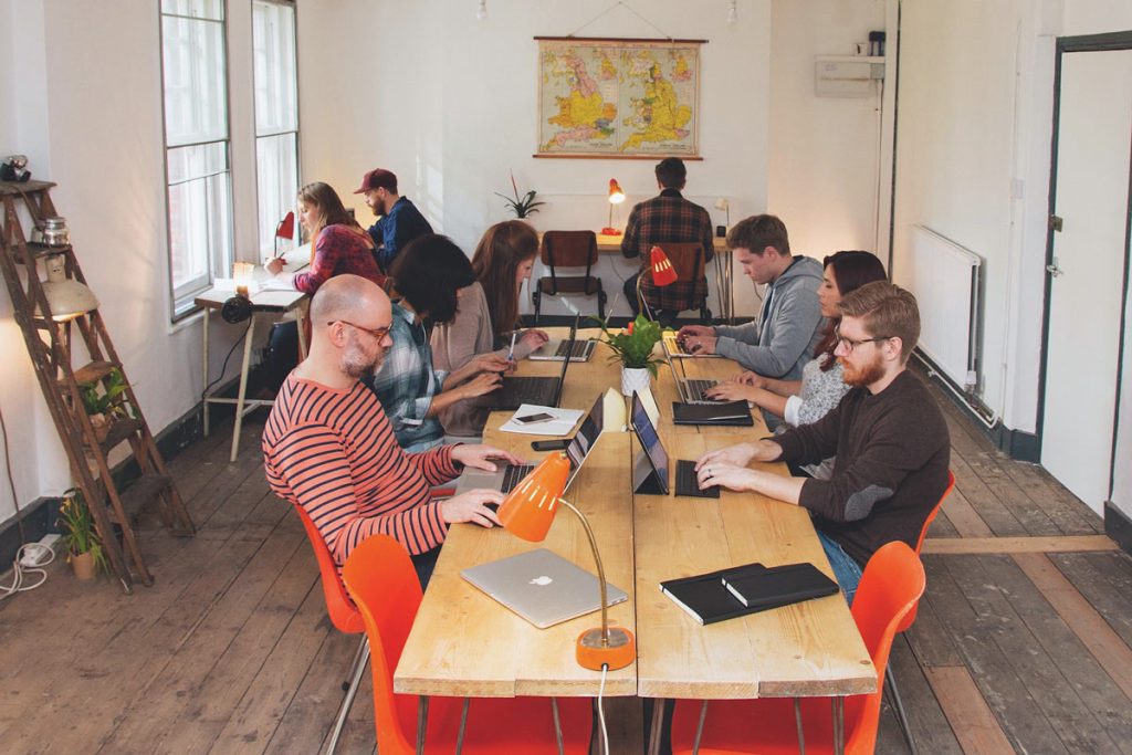 bright office space with large communal co-working table