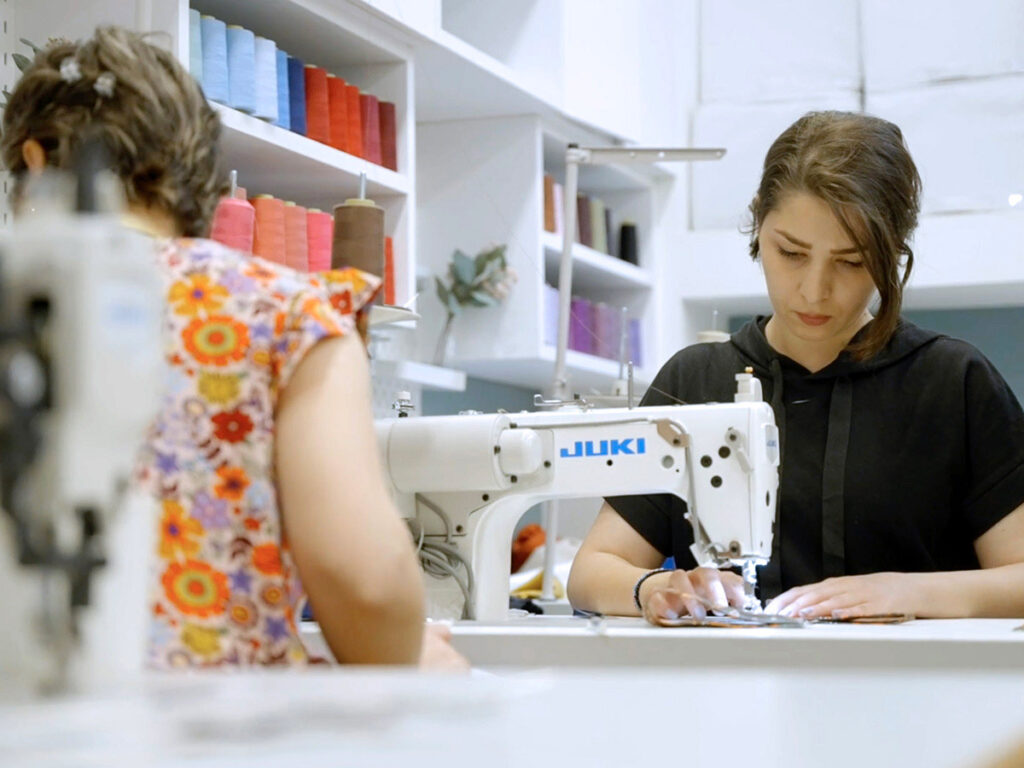young woman at a sewing machine