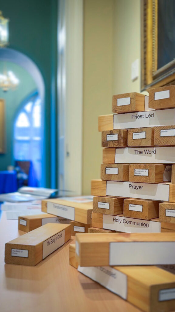 Jenga-like wood blocks labelled with elements of liturgy and church