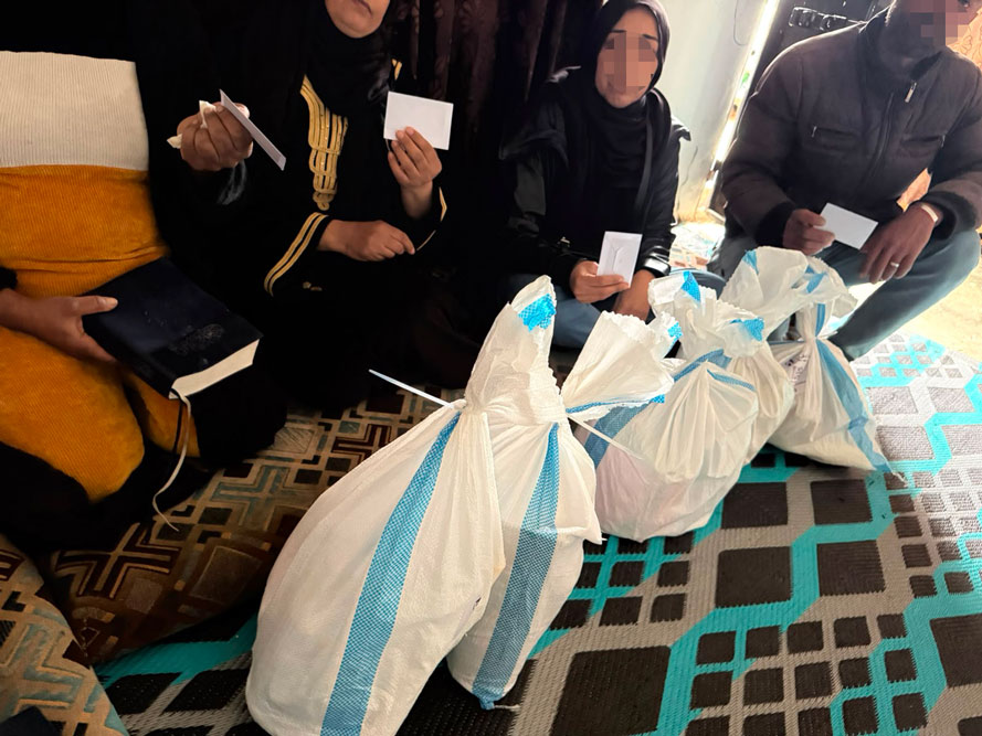 family receive emergency food sacks