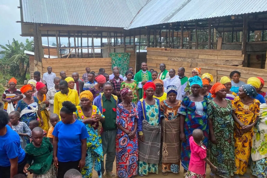 Congolese congregation gather outside a new church