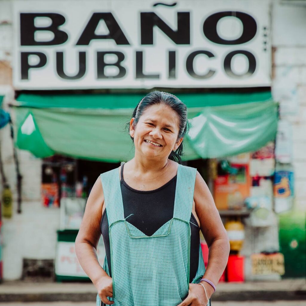 Jenny smiling outside 'BANO PUBLICO'