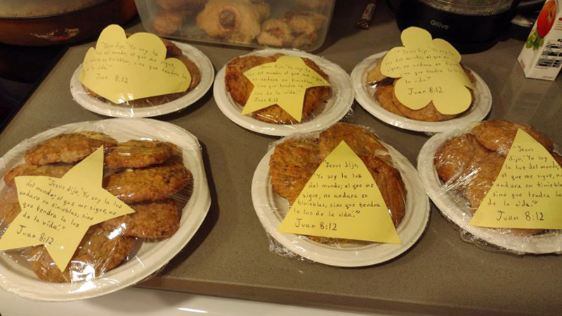cookies on plates with cut-out paper shapes with writing on