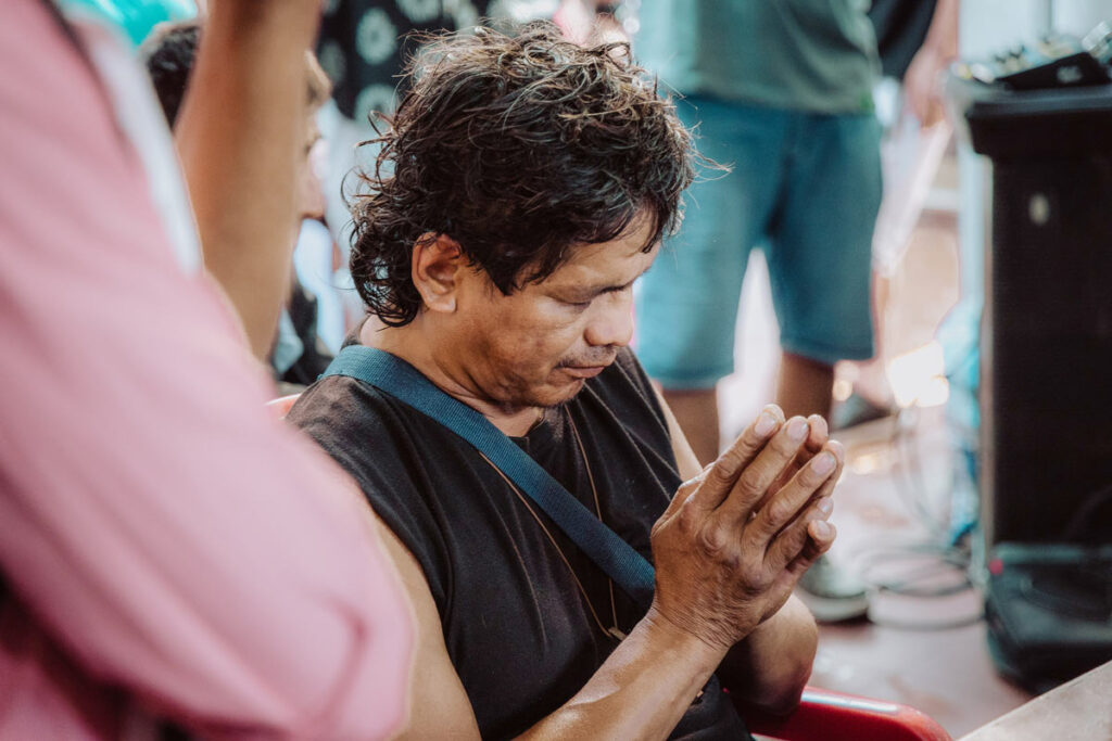 Man with hand together in prayer